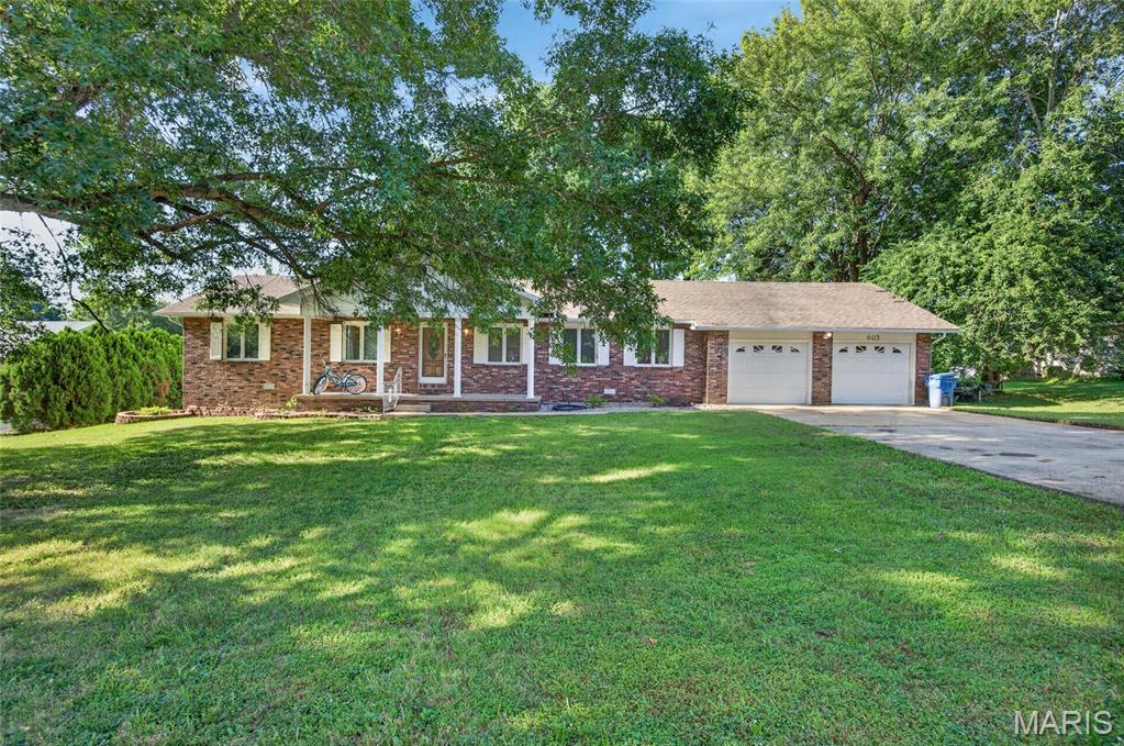 Welcome home to this spacious 3-bedroom, 2-bathroom property offering over 2,000 square feet of comfortable living space on a generous half-acre lot. Nestled in an established neighborhood on the desirable north side of town, this home combines space, comfort, and functionality. Inside, you’ll find two separate living areas, providing plenty of room for entertaining, relaxing, or creating the perfect home office or playroom. One living area features a beautiful full brick fireplace, creating a warm and inviting focal point. The kitchen is well-appointed with granite countertops, stainless steel appliances, and ample cabinet and counter space to make everyday living and entertaining a breeze. Step outside to enjoy the fully fenced backyard, offering privacy and plenty of space for kids, pets, or outdoor gatherings. A storage shed with electricity provides the perfect spot for a workshop, hobby space, or additional storage. Located on the north side of town in a well-established neighborhood, this home offers the space, features, and location you’ve been looking for. Don’t miss your opportunity to make this wonderful property your own—schedule your private showing today!