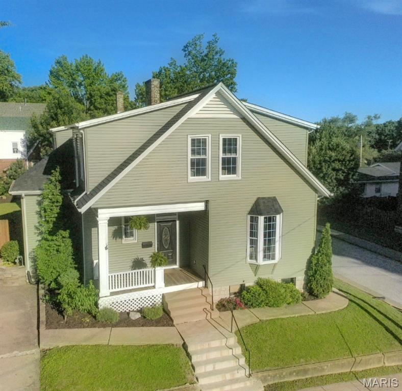 Victorian charm meets modern luxury in historic district St. Charles. New roof/siding (2025), divine center kitchen island, butlers staircase off kitchen, natural lighting throughout. 4 bed/2 bath, corner lot, level backyard, private oasis to enjoy life and celebrate community.Insulated attic space offering option for growth , Thank you for visiting