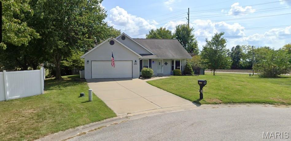 Welcome to this beautifully maintained home tucked away on a quiet cul-de-sac, offering nearly 3,000 square feet of finished living space. From the moment you step inside, you'll appreciate the open floor plan, soaring cathedral ceilings, fresh paint, and new carpeting that give the home a bright, move-in-ready feel. Even better, the roof, HVAC system, and water heater have all been replaced within the last few years, providing valuable peace of mind. The spacious kitchen features Silestone countertops, maple cabinetry, Whirlpool stainless steel appliances, and overlooks the main living area, perfect for everyday living and entertaining. The oversized primary suite is a true retreat with a large walk-in closet and an ensuite bath complete with a whirlpool tub and separate shower. The finished lower level expands your living space with a fantastic recreation area, an impressive wet bar, and a stainless steel refrigerator that stays. Laundry hookups are available on both the main level and in the spacious lower-level laundry room, offering added convenience and flexibility. Step outside to enjoy the park-like backyard featuring a maintenance-free deck with pergola, a large patio, and a storage shed, ideal for entertaining, relaxing, or giving kids and pets plenty of room to play. Conveniently located just minutes from Scott Air Force Base, shopping, dining, and major highways, this home offers the perfect combination of space, updates, and location.