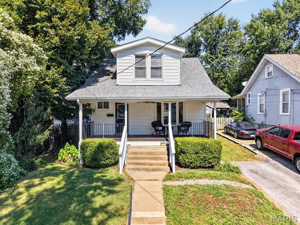 Discover this thoughtfully maintained 2 bed, 2 full bath gem in the heart of Brentwood! Located just steps from the Brentwood Park with nearby trails, this home blends timeless charm with a modern, convenient location. The covered front porch is perfect for enjoying morning coffee or storm watching!

Inside, you’ll find stunning original mill work and hardwood flooring flowing throughout both levels. The sun-drenched living room features a classic bay window and custom built-ins, creating a warm, inviting atmosphere. The kitchen offers ample storage, stone countertops, and updated stainless steel appliances. Step into the versatile sunroom—could be a home office or peaceful retreat for your plant collection. Making your way up the beautiful staircase, the second level offers two spacious bedrooms with generous closet space and a chic, updated full bath. The outdoor space is equally impressive, featuring a wooden deck that overlooks a fully fenced, massive leveled yard complete with a storage shed. The walkout basement offers an additional full bath and flex room for an extra guest, storage, craft, you name it. With a new roof installed in July 2024 & HVAC replaced in 2020, this home is move-in ready!