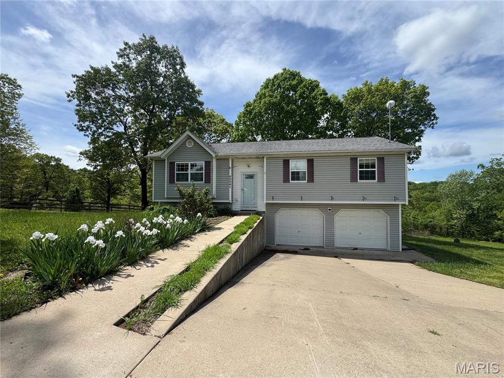 Discover unmatched privacy, space, and modern comfort at 23201 Topo Dr in St. Robert, Missouri, a beautifully updated home positioned at the very end of a quiet country road on 39.72 private acres. This inviting property features an open-concept floor plan filled with natural light and modern updates throughout, including a brand-new high-efficiency HVAC system installed in 2025 for exceptional year-round comfort. The expansive acreage offers endless opportunities for recreation, complete with hunting rights, abundant wildlife, and plenty of room for hiking, exploring, or simply enjoying the peaceful surroundings. Despite its secluded setting, the home is ideally located just 15 minutes from Fort Leonard Wood and 7 minutes from shopping, dining, and amenities in St. Robert, giving you the perfect blend of privacy and convenience. Whether you're a hunter, outdoor enthusiast, or anyone seeking space and tranquility without sacrificing access to town, this property delivers a rare combination of comfort, land, and location.