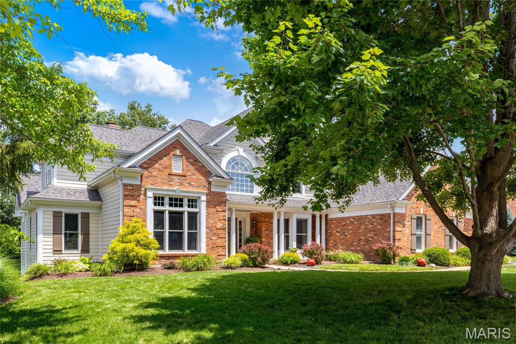 This beautifully designed Miceli-built brick 1.5 Sty features 5040 sq ft of living space enhanced by oak hardwoods, soaring ceilings & detailed trim work. Impressive 2-sty hardwood foyer leads to private study with arched French doors, elegant dining room and spectacular great room with brick fireplace & dramatic wall of windows. Designer kitchen with 42” cabinetry, granite countertops, premium appliances, 8’ center island, butler’s pantry & convenient planning center adjoins breakfast room with French doors to patio & vaulted hearth room highlighted by floor-to-ceiling fireplace & tongue and groove ceiling. Spacious primary bedroom suite offers an appealing retreat with 2 walk-in closets & lavish bath with heated floor & shower spa. T-staircase accesses 3 additional bedrooms, 1 with ensuite bath & 2 with Jack n’ Jill bath. Walk-out Lower Level includes recreation room with entertainment center & wet bar, game room & wine cellar plus 5th bedroom & full bath. Extensively landscaped cul-de-sac lot with 2 patios & 3-car garage.