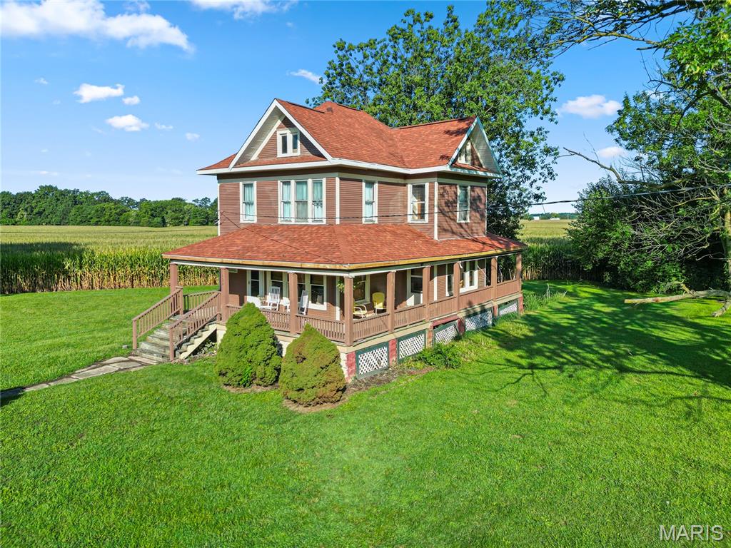 Welcome home to this beautiful classic farmhouse, where timeless charm meets modern updates! This inviting property sits on 5.88 +/- acres and features a gorgeous wrap-around porch, perfect for enjoying your morning coffee, relaxing in the evening, or taking in the peaceful surroundings. As you enter the home, you’ll be greeted by a stunning cascading staircase that adds an impressive touch of character and elegance.

The home boasts recent modern updates while still maintaining the charm and character you would expect from a classic farmhouse. All bedrooms, the bathroom, and laundry are conveniently located together on the second level. The home is move-in ready and simply waiting for its new owners to add their own personal touches and make it truly their own.

The acreage offers plenty of possibilities to enjoy the outdoors and make the property fit your lifestyle. A natural spring is located on one corner of the property, adding to its unique charm. The property is currently leased to a local farmer for the 2026 crop year. Beginning in 2027, the new owner will have the flexibility to establish a new agricultural lease, return the field to yard space, or convert the acreage to pasture, offering plenty of possibilities to make the property their own.

With its classic farmhouse character, modern updates, beautiful wrap-around porch, and 5.88 +/- acres, this property offers a wonderful combination of charm, space, and opportunity. Come see all this special property has to offer!  

Home is being sold AS-IS with all remaining items included. Lot size and acreage are based on information provided by Montgomery County GIS and are not guaranteed. Buyer and Buyer’s Agent are responsible for independently verifying lot size, acreage, boundaries, and all related information.