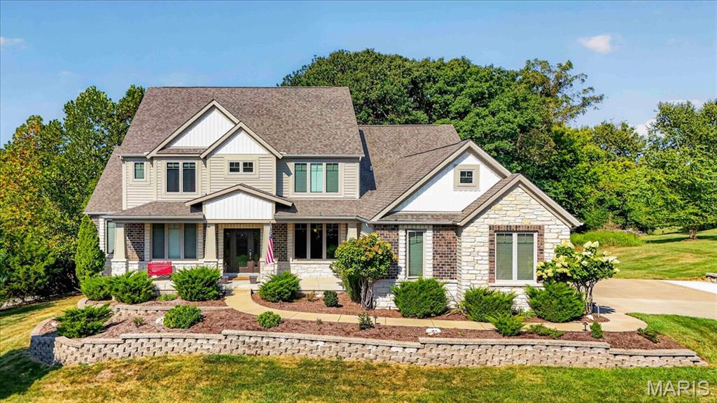 Located on a 1.24-acre corner lot backing to mature trees in Wildwood’s highly
desirable Homestead Estates, this beautiful residence offers generous space, comfort,
and thoughtful details throughout. The main floor includes a private primary suite, a
spacious great room, and a modern kitchen with a gas range, stainless steel
appliances, walk-in pantry, granite countertops, and large center island. Upstairs, three
additional bedrooms provide flexible space for family, guests, or a home office. The
finished lower level adds a large recreation room, full bath, exercise room that could
serve as additional sleeping space, and ample storage. Additional features include
main-floor laundry, a three-car garage, dual-zone HVAC, and a covered deck
overlooking a wooded setting. Schedule your visit today and see why 1307 Homestead
Heights Drive is ready to welcome you home.