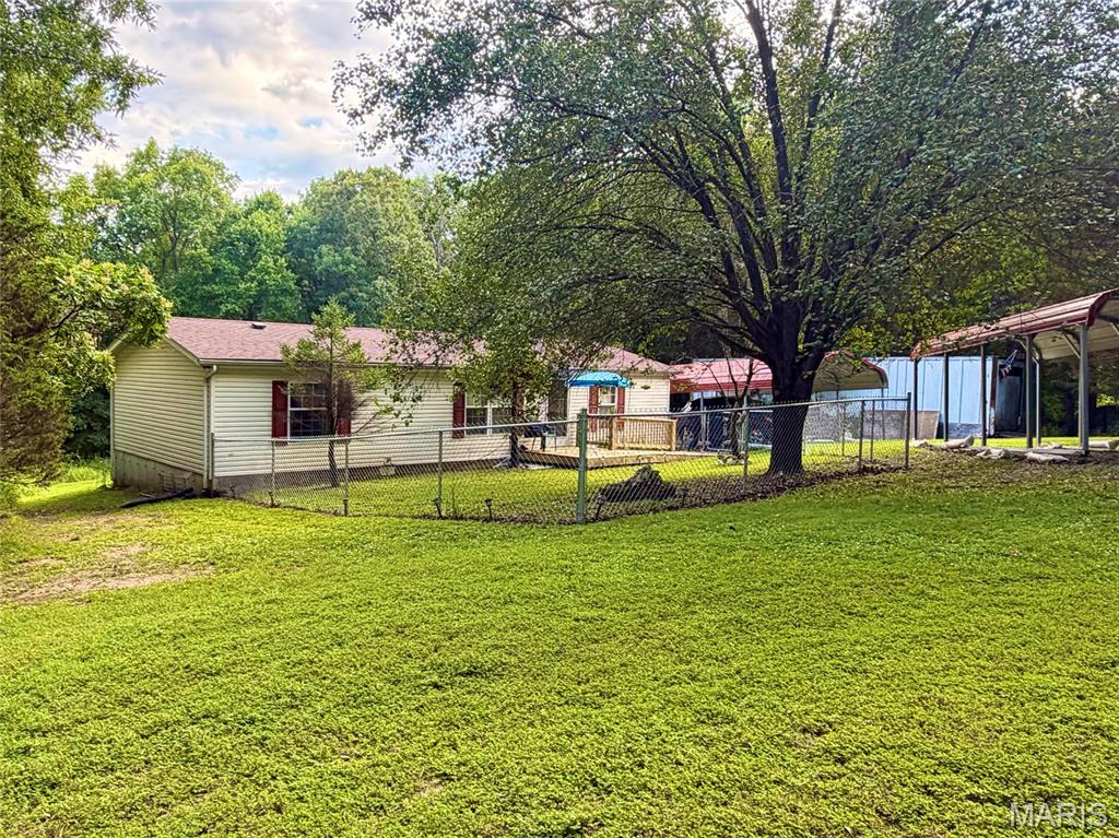 Escape to Your Own Private Paradise on 3.3+ Beautiful Acres!

Looking for peaceful country living with room to enjoy? Welcome to 7720 Lange Drive in Cedar Hill, Missouri! Nestled on 3.3+ picturesque acres surrounded by mature trees, this property offers the privacy and serenity you've been searching for.

This spacious 3-bedroom, 2-bath double-wide home features a desirable split-bedroom floor plan, convenient main-floor laundry, and comfortable living spaces ready for your personal touch. While the home could benefit from fresh paint and new flooring, it offers an incredible opportunity to build equity and customise it to your own style.

Outside, you'll find plenty of room for vehicles, equipment, and hobbies with three covered carports plus a large storage trailer that stays with the property, providing exceptional storage space. Whether you're dreaming of gardening, entertaining, enjoying nature, or simply relaxing under the shade of beautiful mature trees, this property delivers endless possibilities.

Enjoy the peace of country living while remaining conveniently located near shopping, schools, parks, and major highways. If you've been searching for acreage, privacy, and value in Jefferson County, this is a property you won't want to miss.

Bring your vision and make this private Cedar Hill retreat your forever home! Schedule your showing today!  Showings by appointment Only!