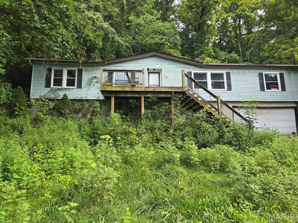 Opportunity in House Springs. Full Gut rehab in sought after Woodridge. Home is seconds from the Northwest Early Childhood Center on Hwy MM and sits on nearly 3/4 of an acre. Public water and sewer.