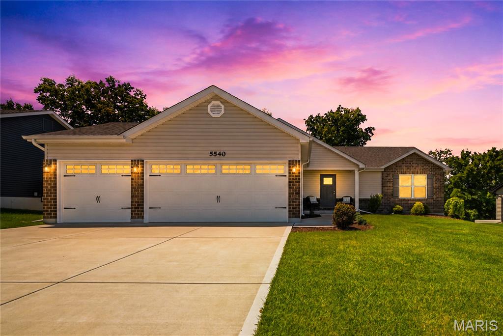 2 years young with all the options.  This home comes complete with LVP flooring,  framed windows, and taller baseboards.  Kitchen includes 42" cabinets, with cushion close, and quartz countertops with tile backsplash.  stainless steel appliances.  Adult-size cabinets in bathrooms with marble countertops.  Main floor laundry.  Split bedrooms, Primary opposite, bedrooms 2 & 3.  3 car Garage with Upgraded carriage garage doors with openers. All lighting fixtures were upgraded, as well as Water fixtures. Vaulted Ceilings, rounded "bullnose" corners. Home backs to New North Point High School, walking path next house down. Don't miss your chance to view this adorable home.