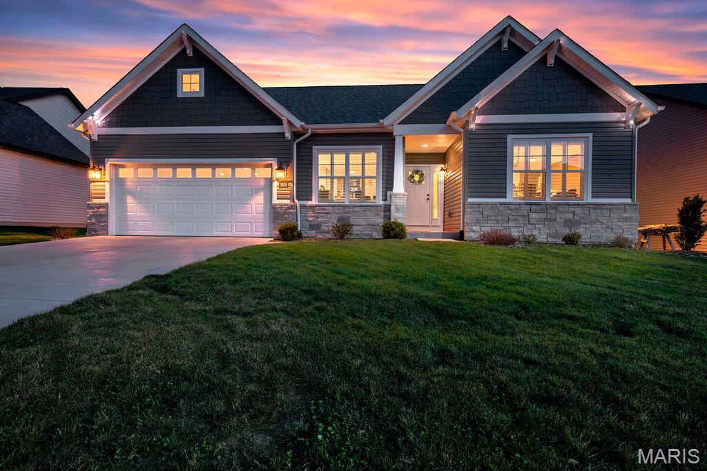 Why wait to build when you can step right into this stunning, nearly new 2024 home? Thoughtfully designed with an open and airy layout, this residence blends modern style with everyday functionality. 
A private office with elegant French doors offers the perfect space for work or a quiet retreat, while the split bedroom floor plan provides added privacy. Everyday convenience shines with a functional drop zone located just off the garage and laundry area.
Natural light pours throughout the home, beautifully complemented by custom Norman plantation shutters that provide both style and flexibility. The kitchen is truly the heart of the home, featuring striking two tone cabinetry, stainless steel appliances, solid surface countertops, and a spacious center island, all opening to a warm and inviting great room with a gas fireplace and built in bookcase.
The lower level expands your living possibilities with approximately 360 square feet of finished space and a full bath, ideal for entertaining, hobbies, or relaxation. Additionally, over 1,400 square feet of unfinished space offers incredible potential for storage or future customization. An egress window is already in place, making the addition of a fourth bedroom simple and convenient.
Located in Greystone Estates, residents enjoy access to neighborhood amenities including a community pool, perfect for relaxing and connecting.
Schedule your private showing today and experience everything this exceptional home has to offer.