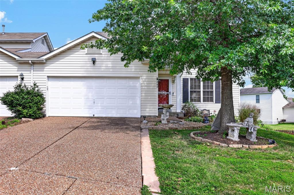 Charming Wentzville Condo with walkout basement and fenced backyard! Welcome to 247 John Charles- A spacious 3-bedroom, 3 full/1 half bath condo offering the rare combination of finished lower-level living and true outdoor space in a low-maintenance setting. The main level features an open-concept layout with luxury laminate flooring that flows from the dining area into a bright, updated kitchen with white cabinetry, stainless steel appliances, and island seating. Step out to the upper deck for grilling and relaxing while overlooking a large, flat, fully fenced backyard- ideal for pets, play, or entertaining. The walkout lower level adds fantastic bonus living space, complete with brand-new carpet throughout and direct access to the backyard- perfect for a rec room, home office, or additional living area. With fresh updates, a functional floor plan, and a backyard that's hard to find in condo living, this home is move-in ready. Schedule your showing today