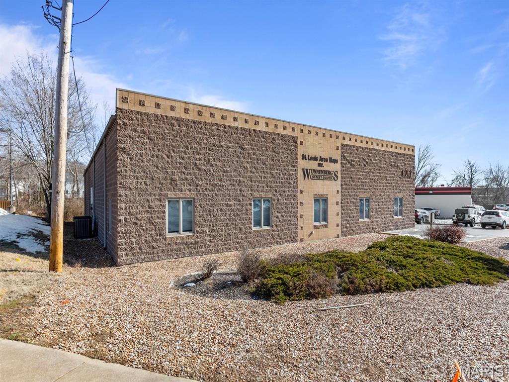 Great opportunity to own large office/warehouse building on a busy intersection. This building offers 7,400 sq ft on .55 acres. Finished office area consists of 2,400 sq ft of space: 5 offices, 1 mechanical room, one work room, one break room and one shipping room plus 2 restrooms. Warehouse space totals 5, 000 sf., heated/cooled with clear height of 14' to 15'. Additional features of building: 2 new HVAC systems servicing office area, 3 phase 250 amp electric panel, 10'x8' dock door (1), 10'x10' Drive-in doors (2). Roof has been inspected and is in great condition by certified inspector. Located minutes from I-55, I-270 and I-255.