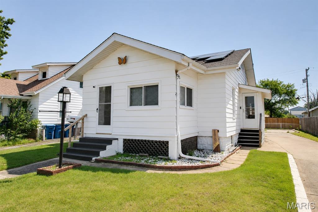 Enjoy the charm and simplicity of this 2-bedroom, 1-bath home featuring a welcoming enclosed front porch and a functional layout. The large basement offers abundant storage and endless potential for a workshop, recreation area, or future finishing. Whether you're a first-time buyer, downsizing, or looking for an investment opportunity, this home is ready for its next chapter! The residence is equipped with a leased solar panel system to help reduce monthly energy expenses. Selling "As-Is', seller will do no repairs but will provide occupancy permit.