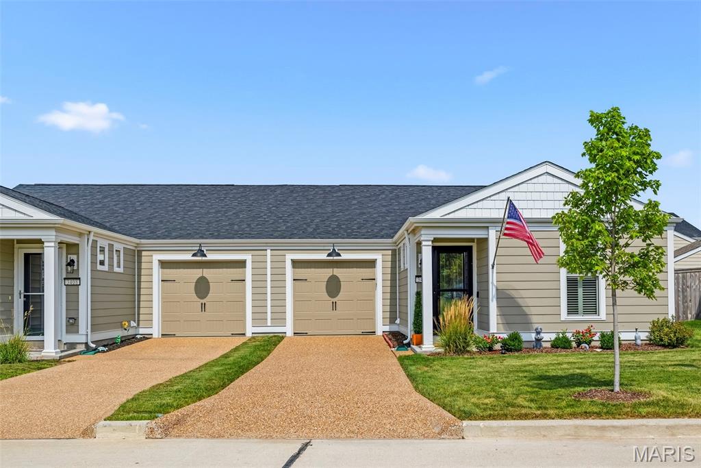 Move right into this ADORABLE 3 bedroom 2 bath ranch home just two years old!  Conveniently located in the heart of New Town within walking distance to parks, restaurants & more! Light filled entry foyer with 2 transom style windows. Beautifully upgraded kitchen featuring 42” cabinetry with newer hardware & under cabinet lighting.  SS appliance package to include electric range, built-in microwave, DW + French door Refrigerator to stay! STUNNING QUARTZ countertops, breakfast bar & backsplash + Blanco undermount sink installed by The Stone Company in 2025. Open concept floor plan between kitchen and living room featuring lots of recessed lighting & durable Luxury Vinyl Plank flooring! 52” ceiling fan with 6 speed remote added 2025. 2 additional ceiling fans added to 2ndary bedrooms 2024.You’ll love the spacious primary suite offering custom closet organizers installed by St Louis Closet Company 2026. Primary bath has newer marble vanity top, faucet & framed mirror. 2nd bedroom converted to an ensuite by The Stone Company in 2025 by adding access to the hall bath through Barn Doors! Clever! Both baths have newer adult height commodes (2024) & taller vanities (2026). Main floor laundry & pantry also offer custom organizers from St Louis Closet Company. Full size stackable washer & dryer can stay. Plantation shutters from Blind Ambition installed 2024. Upgraded carpet installed in all 3 bedrooms 2025. Other improvements made after purchase include garage door opener & keypad + storage shelf, 2 storm doors with retractable screens & Aprilaire humidifier all added 2025.Come enjoy the perfect yard to relax in with 6’ CEDAR FENCE installed by Dragonfly in 2024 complete with patio & added Pergola (2025). Perfect for entertaining friend and family! Nothing left to do but move right in! Professional pictures to be uploaded Tuesday, August 25 with showings to begin Friday, August 28, 2026. Welcome Home!