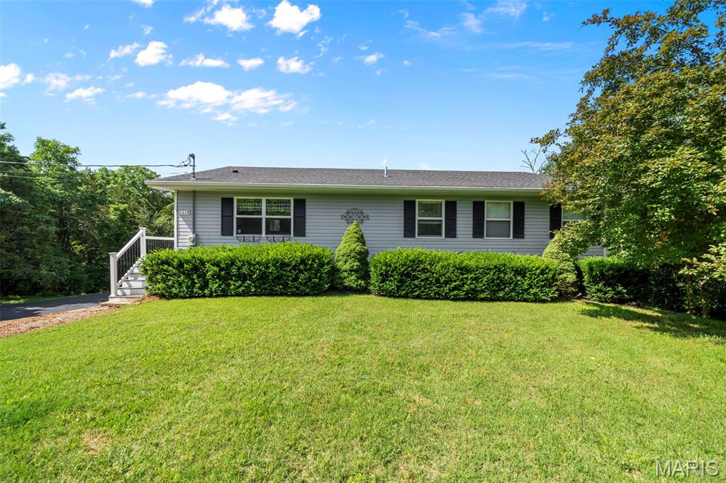 Don't miss your chance to own this 4 bed, 3 bath hidden gem LAKE FRONT just in time for the summer! Located in the beautiful, private lake community of Terr Du Lac, minutes from Bonne Terre MO, and Highway 67. French for "Land of Lakes," Terre Du Lac residents, enjoy Access to all 16 lakes,  plus a full beautiful golf course, range, putting greens, club house, and bar. 

This house is located right on one of two of the largest and most popular lakes in the community. With private water access from the backyard, options for boating, fishing, water skiing, tubing, and beach acess, just a 3 minute boat ride away, you will have your lake plans covered all season.  Acess it all from your private covered boat dock, with stairways up to the patio, screened in porch, and 2-story wrap around deck.

Inside, the 2900 sq. ft of living space includes a large living rm & adjoining dining rm plenty of space to gather, and a large eat in kitchen with pantry and main floor stackable washer/dryer (inclued in sale, along with all kitchen appliances). 

Enjoy the large sunroom (currently used for dining) as an area to watch the views while inside. The main level has two bathrooms and two bedrooms with and attached primary bath, where you can rest up for another fun day at the lake. The additional large upstairs bedroom has a wood burning fireplace, acess to the deck, and could easily be converted into a family room. The fully finished basement has 2 more bedrooms and a full bath, perfect for a large family or overnight guests. 

Stop by and check out your next oasis on the lake. Showings start Thursday, June 4th.