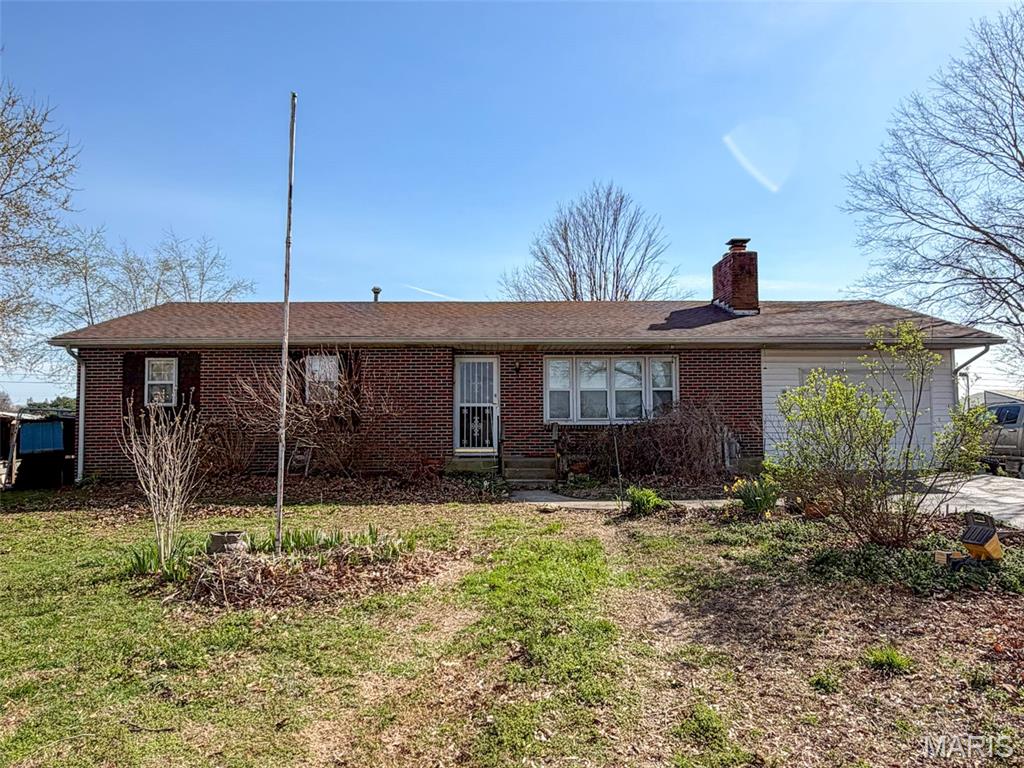 Charming brick home on .57 acres ready for a fresh start. After sustaining fire damage earlier this year, this property is waiting for someone with vision to bring it back to life. The fire was contained to the basement. Featuring 3 bedrooms, 1 bathroom, a full basement, and an attached garage, the home offers plenty of potential. Outside, you'll find a 25' x 30' shop with approximately three-quarters of the building on a concrete slab, a greenhouse, established garden, and plenty of outdoor space to enjoy.