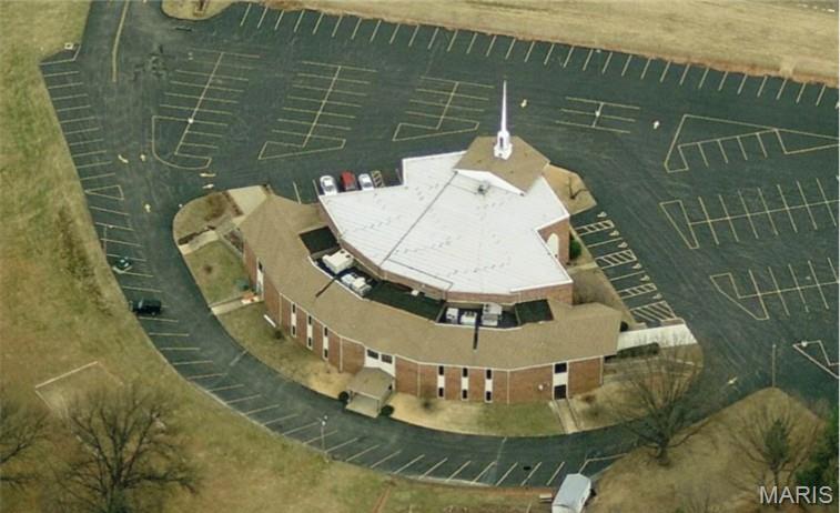 Great multi-level building featuring 2 stories with 27,815 sq ft of space plus 8.43 (+/-) acres (this includes two lots). Building offers a large entry into the building, partial lower level (semi-circular area, beneath the classroom/offices of the main level) with look- out windows, partly below grade but with walk-out, main rear entrance.  Also, included: sanctuary with 405 capacity, fellowship hall with kitchen, office and classrooms.  There is ample parking on the large lot, 86,028 sf paved. The location has accessibility to Hwy 70, 270 and 364 and visibility from Hwy 70.  Approx. 7.62 acres is developed, .81 acres is undeveloped for future use. Awesome location and building ready for new owners.