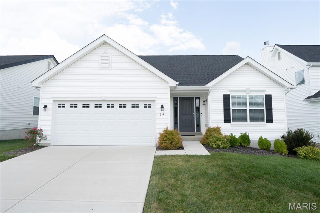 New McBride Homes Aspen II 3BR, 2BA ranch floorplan, move-in ready this spring! Walkout homesite! Enjoy an open floorplan w/vaulted ceilings, 6’ windows, & beautiful wood laminate flooring in main living areas. The kitchen has a large island w/ breakfast bar, Burlap 42” cabinets, quartz countertops, stainless steel GE appliances, & large walkin pantry. The dining area has a sliding glass door that leads to a covered future deck area w/ceiling fan prewire. The primary suite has a large window, dual closets, & private bath w/double sinks & walkin shower. Other extras include main floor laundry, ceiling fan prewires, ¾ bath rough in at LL, upgraded lighting & matte black plumbing fixtures, two panel interior doors, plus coach light. Located in House Springs, this community features 263 homesites off Bear Creek Road, just east of Gravois Road and Carol Park Road. Enjoy peace of mind with McBride Homes’ 10 year builders warranty & incredible customer service! Similar photos shown.