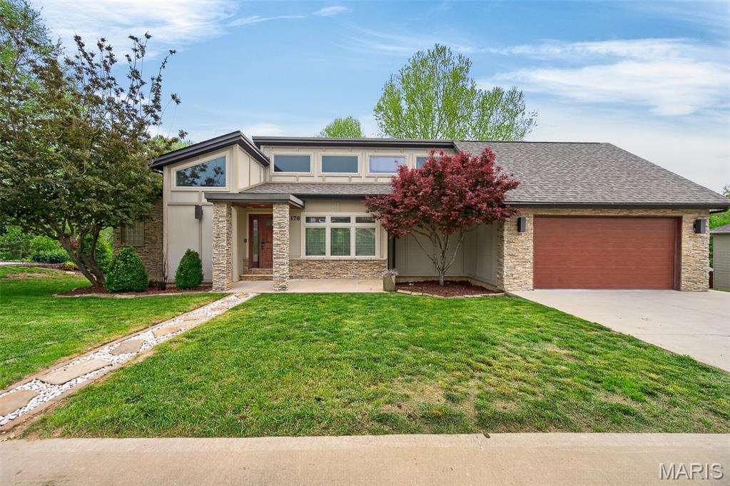 You won't want to miss this truly stunning and unique  5-bedroom, 3.5-bath home featuring a blend of modern updates and timeless design-everywhere you look, there is something to admire! The living room offers wood floors, high ceilings, built-in bookcases, and a floor-to-ceiling stone wood-burning fireplace.  The kitchen is stunning with granite countertops, an island with a breakfast bar, stainless steel appliances, a double wall oven, a wine bar area with a wine cooler, and a gas range. It opens to the formal dining room, which features French doors leading to a screened-in covered porch— ideal for enjoying morning coffee or relaxing evenings. The primary suite includes a spacious walk-in closet with built-in organizers, a jetted tub, a separate shower, and a sitting area with a gas fireplace.  The second bedroom has a private bathroom and a walk-in closet.  The fully finished walkout basement is accessed via a glass stairway and includes 3 additional bedrooms with a Jack-and-Jill bathroom, 2 large family rooms, and a storage room.  Come and see this one-you won't be disappointed!