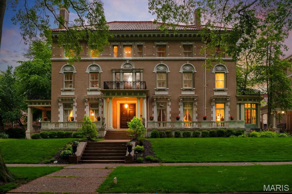 Step into a piece of history upon entering this stunning mansion on private and prestigious Washington Terrace, a street in the National Register of Historic Places and a St. Louis City Landmark. This 1903 Second Renaissance Revival masterpiece, designed by architects Weber & Groves, perfectly blends grand architectural heritage with refined modern amenities. Upon arrival, the stately portico columned entrance flanked by guardian lions sets a tone of timeless elegance, continued with a classic porte-cochere over the side door entrance—a rare architectural touch that provides both style and sheltered convenience. Spanning an impressive 9,667 square feet, this 18-room historic landmark offers an expansive floor plan designed for both grand-scale entertaining and sophisticated everyday living. The elegant foyer leaves you in awe as your eyes take in the beauty of glistening refinished hardwood floors and old-world early 20th century ornate craftsmanship. Exquisite Arabesque carvings in a rich, dark finish adorn the wood throughout the entryway and staircase. The home’s heritage is preserved through 10 sets of pocket doors and 9 hand carved fireplace mantels distributed across all three levels. On the main level you’ll find a parlor with hand carved cherub embellishments on the massive mantel, intricate ornate crown molding and floor to ceiling windows, a library with original built-in desk/bookcases and an ornate ceiling border, a living room with exquisite crown molding and the original non-electric candle chandelier, a curved solarium with access to the private courtyard, a formal dining room with a sparkling Waterford crystal chandelier as its focal point, and a Chef’s Masterpiece Gourmet kitchen - a stunning blend of historic charm and modern conveniences. Featuring a hearth room, brick walls, tall arched windows, and granite countertops, it is fully equipped with premium appliances: a Gaggenau cooktop, Subzero refrigeration, Electrolux double ovens, and a Bosch dishwasher. A separate coffee/wet bar with a beverage refrigerator and a dedicated breakfast seating area complete the kitchen. The beautiful Grand Staircase includes a curved window seat with leaded glass soaring to the ceiling and leads you to the 2nd floor Grand Landing highlighted by 2 stunning crystal chandeliers. From there, step out onto the front balcony and enjoy the view of this historic street. The Primary Suite includes a Powder/Dressing Room with 2 walk-in closets, as well as an ensuite bath with built-in closets and access to the side balcony. Also on the 2nd floor, you'll find 3 more bedrooms, and 2 original marble bathrooms. The 3rd floor boasts an additional 3 bedrooms, a full bath, and a craft/hobby room, as well as a media room and a ballroom/recreation room, both ideal for grand entertaining. A 4th level of space - the attic - accessible from the media room, has 15-foot ceilings and has been used as a roller-skating rink in the past with a disco ball at its center. For relaxation, the home offers 4 private balconies—including one overlooking the pool—and two featuring newly installed copper flooring. All of this space, plus central air-conditioning (3 new condensers installed in 2025) and radiant heat throughout the home, offer ample space for family and guests to retreat in comfort. Outside, the grandeur continues with a 3-car garage equipped with EV chargers, an in-ground, heated, saltwater pool, a wraparound porch with hot tub and a beautiful English garden/courtyard adjacent to the curved solarium – areas all perfect for entertaining. A home of this scale and pedigree is a rare find. Over $1 million has been put into the home since the current owner purchased it in June of 2021, with most of the improvements being done since the May 2025 tornado.  Don’t miss your chance to own this Grand, Magnificent Masterpiece!