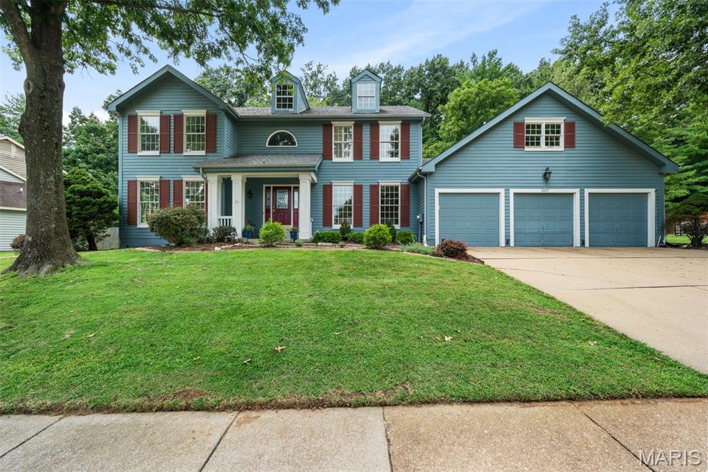 Beautiful Wildwood 2-story offering 3,500+ sq ft of finished living space in the Rockwood School District! A soaring 2-story foyer welcomes you with gleaming hardwoods, large bay windows & gorgeous plantation shutters. Formal dining room, living room/office with French doors & spacious family room with fireplace, built-ins & wet bar create inviting spaces for both everyday living and entertaining. A well-appointed kitchen features a center island, custom cabinetry, stainless appliances, double wall ovens, gas cooktop & bright breakfast area with a walkout to the rear patio! Main-floor laundry & powder room add convenience.

Upstairs, four carpeted bedrooms include a spacious primary suite with vaulted ceiling, walk-in closet & spa-inspired bath featuring dual vanities, soaking tub & glass-enclosed shower with bench. An updated hall bath with dual vanities serves the secondary bedrooms. The partially finished lower level provides a massive rec area, second family room, wet bar, full bath & abundant storage—perfect for movie nights, guests or hobbies.

Exterior highlights include a covered front porch, 3-car garage, large concrete drive, Hardie board siding & a serene rear patio surrounded by mature trees & beautiful landscaping—perfect for hosting summer cookouts or enjoying cocktail hour with friends. Neighborhood pool & tennis courts are just down the street! Located in the sought-after Rockwood School District, this home offers convenient access to shopping, restaurants, parks & everyday amenities. Spacious living areas, thoughtful updates, beautiful outdoor spaces & an ideal Wildwood location come together to create a home you’re sure to love.