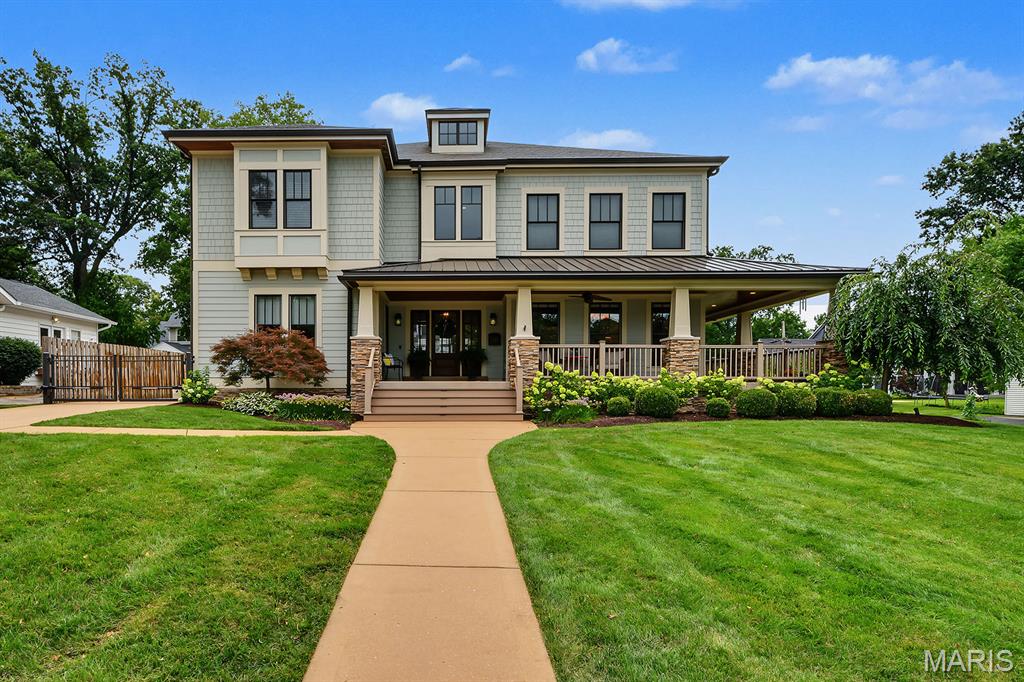 Welcome home to this exceptional Glendale residence, built in 2011 and thoughtfully designed to blend timeless architectural charm with the comforts of modern living. Situated on a picturesque corner lot in the highly rated Kirkwood School District, this beautifully appointed home offers a fenced backyard and an unbeatable location just steps from Hannekes, the neighborhood market.
A welcoming wraparound porch sets the tone for the inviting interior. Inside, the open-concept floor plan is perfect for both everyday living and entertaining, featuring a formal dining room, private home office, and an impressive sunken family room filled with natural light. The gourmet eat-in kitchen is the heart of the home, complete with a center island, generous walk-in pantry and seamless access to an oversized mudroom.
Upstairs, you'll find three spacious bedrooms, including a versatile recreation room originally designed as a fourth bedroom. With the addition of one wall, the space can easily be converted back to suit your needs. The primary bedroom suite features a huge walk-in closet and heated bathroom floors.
The outdoor amenities are equally impressive, highlighted by a detached three-car heated garage with a beautifully finished upper-level bonus space—perfect for a home office, fitness studio, media room, or guest retreat. The expansive lower level is a blank slate, offering abundant storage and endless potential for future living space.
This is a rare opportunity to enjoy life in one of Glendale's most sought-after streets, known for its welcoming community, block parties, wine crawls, and exceptional location.