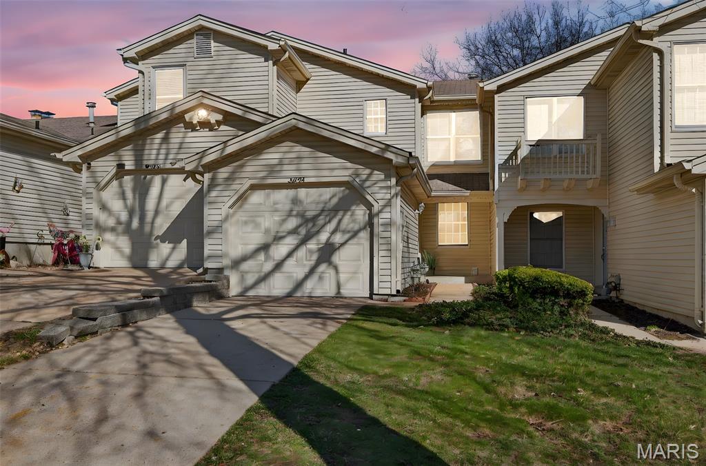 Welcome to this gorgeous townhome loaded with updates! Gorgeous kitchen with custom cabinetry, stainless appliances, ceramic tile floor and back splash. Refrigerator stays! Freshly painted throughout. Family room has a gas fireplace. Both upstairs bedrooms are generously sized with large closets, and each has its own updated ensuite bathroom! Brand new carpet in both bedrooms! Unfinished walk out lower level will be an awesome future finish with a rough in for a future bath and a fireplace!  Washer and dryer stay! Residents of Autumn Lakes enjoy exceptional amenities including 2 private lakes, a clubhouse, swimming pool, pickleball/ tennis courts all set with a serene, park like setting. Water, sewer, and trash are included in HOA assessment. For more information visit www.autumnlakesstl.com.
