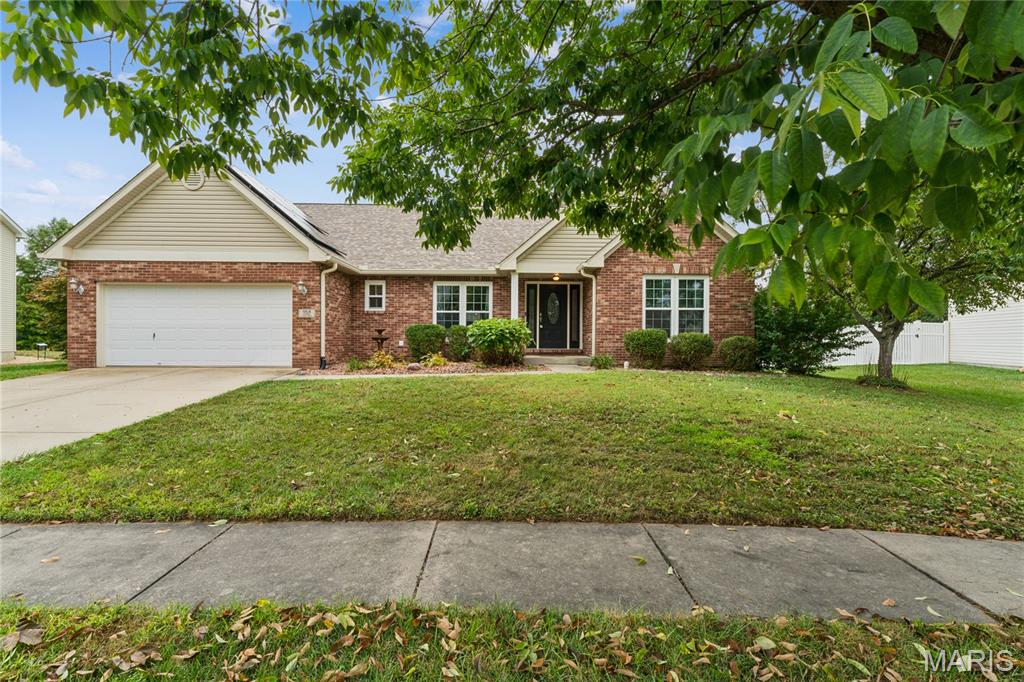 Welcome to 964 Prairie Crossing, a spacious O’Fallon ranch offering easy main-level living, a flexible floor plan, and room to spread out. Hardwood floors, vaulted ceilings, and a gas fireplace create a warm, inviting feel, while the open layout connects the living room, dining area, and eat-in kitchen for effortless everyday living and entertaining.
The kitchen delivers with granite countertops, a breakfast bar, walk-in pantry, stainless steel appliances, and a gas range. The split-bedroom design gives everyone a little breathing room, with two secondary bedrooms sharing an updated full bath and a generous primary suite featuring a walk-in closet, jetted tub, separate shower, and double vanity. A dedicated office with a stylish barn door adds flexibility and may also serve as an additional bedroom. Main-floor laundry means fewer trips up and down the stairs, always a win.
The lower level offers loads of possibilities, including a bathroom and plenty of space for a gym, hobby room, future living area, storage, or the holiday decorations you’re definitely going to organize this year.
Outside, enjoy a fully fenced backyard with a new fence in 2025, large patio, and fire pit area ready for evenings with friends, quiet weekends, or that patio furniture collection that somehow keeps growing. A new roof in 2025 adds peace of mind, while the home’s solar system offers another energy feature for the next owner. Solar is subject to an existing transferable Power Purchase Agreement; buyer qualification and assumption apply.
Conveniently located near the O’Fallon YMCA, parks, shopping, dining, Downtown O’Fallon, Scott Air Force Base, and major commuter routes, this home keeps everyday conveniences and local favorites close at hand.
Flexible, well-located, and full of possibilities, 964 Prairie Crossing delivers the space, comfort, and convenience that make everyday living easy. Come see why this O’Fallon ranch deserves a spot at the top of your list.