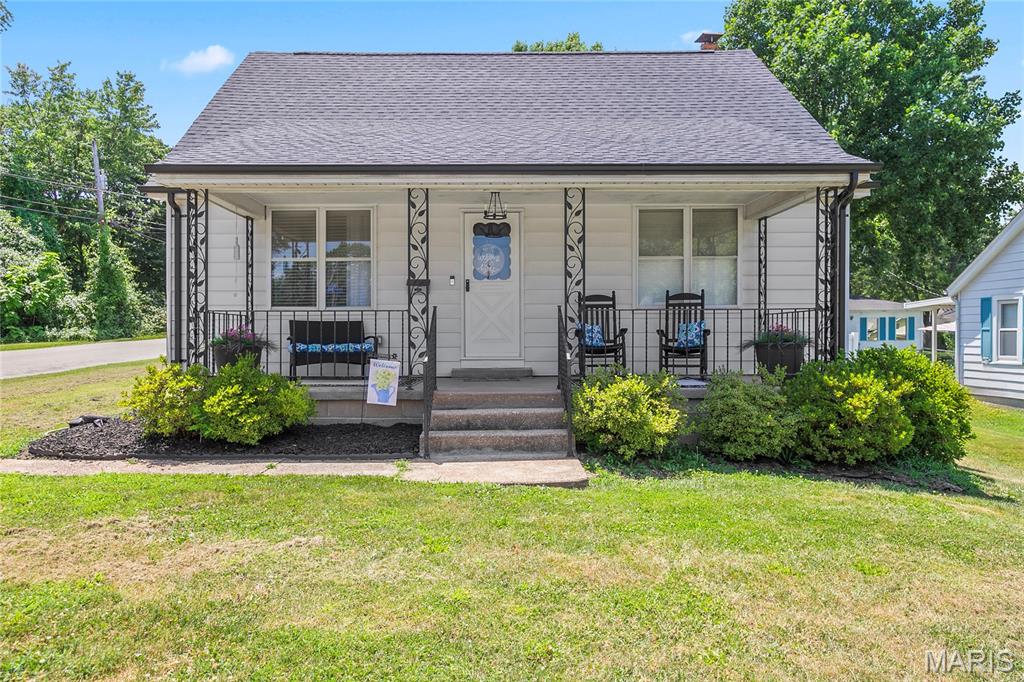 ***SHOWINGS BEGIN ON SATURDAY 7/18 at the Public OPEN HOUSE FROM 1-3 PM!***
This charming 1.5-story home in the desirable Festus R6 School District is COMING SOON! 
Situated on a beautiful corner lot, that boasts modern updates through out. You'll love this 3 bedroom, 2 bath home, which has an inviting layout, that is bound to be perfect for any buyer! The adorable curb appeal welcomes you with an inviting front porch, as you step inside the open living room with newer flooring that flows seamlessly into the beautifully updated kitchen, that features white shaker cabinets, newer black stainless steel appliances, and a beautiful custom center island which is a real “Show Stopper!” The main floor includes a gorgeous primary bedroom with a modern en-suite, which not only has a fully tiled walk-in shower, but also has a  walk-in closet! The main level also has a beautifully updated hall bath with a fully tiled shower/tub combo. Let's not forget the huge main floor versatile laundry room, that can also house a large dining table right off the kitchen! Upstairs you'll find two spacious bedrooms with lots of storage for all your holiday decorations! Let’s talk about the oversized 1 car garage space, and the additional 2 car garage spaces that the seller added which will thrill any car enthusiast! You’ll absolutely love this 3 car garage! There’s newer interior doors throughout, newer wide white wood look blinds, newer roof, and sellers just put in a new hot water heater. This home also has newer plumbing, and is all plumbed to install a water softener if wanted. Now let’s talk about that private outdoor space which is perfect for family fun, and entertaining, you’ll love the white privacy fenced in yard to keep your kiddo’s & fur-babies safe and protected!  This gorgeous “DOLL HOUSE” is perfect for any family, and won’t break the bank! The pride of ownership definitely shows in this one of a kind home right in the “Heart of Festus!”