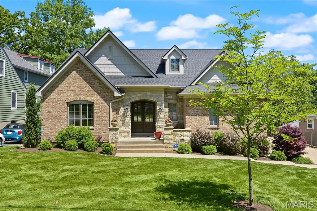 Modern luxury meet timeless charm in this French cottage style home. Step into a spacious foyer & vaulted family room w/beamed ceilings & a hand-laid stone fireplace. Handscraped White Oak floors through entire main level flow into a chef’s kitchen w/ quartz counters, custom cabinetry, laser cut backsplash & a center island w/integrated pet feeding station.  A vaulted primary suite stuns w/ a reclaimed wood accent wall, California closet & spa-style bath with walk-in shower & air-jetted tub. Two additional bedrooms share a Travertine-tiled Jack & Jill bath. Fully finished walk-out lower level is basically a 2nd home-w/its own keyed entrance, full kitchen, laundry, dining/family space & primary suite. Perfect for guests, multigenerational living or Airbnb potential. Outdoor living shines w/ a screened patio, lounge deck, firepit & fenced yard.  A 3-stop In Home Elevator, dog wash area & garage w/ a 3rd car lift complete the package. Just steps from Webster’s expanding community center.
