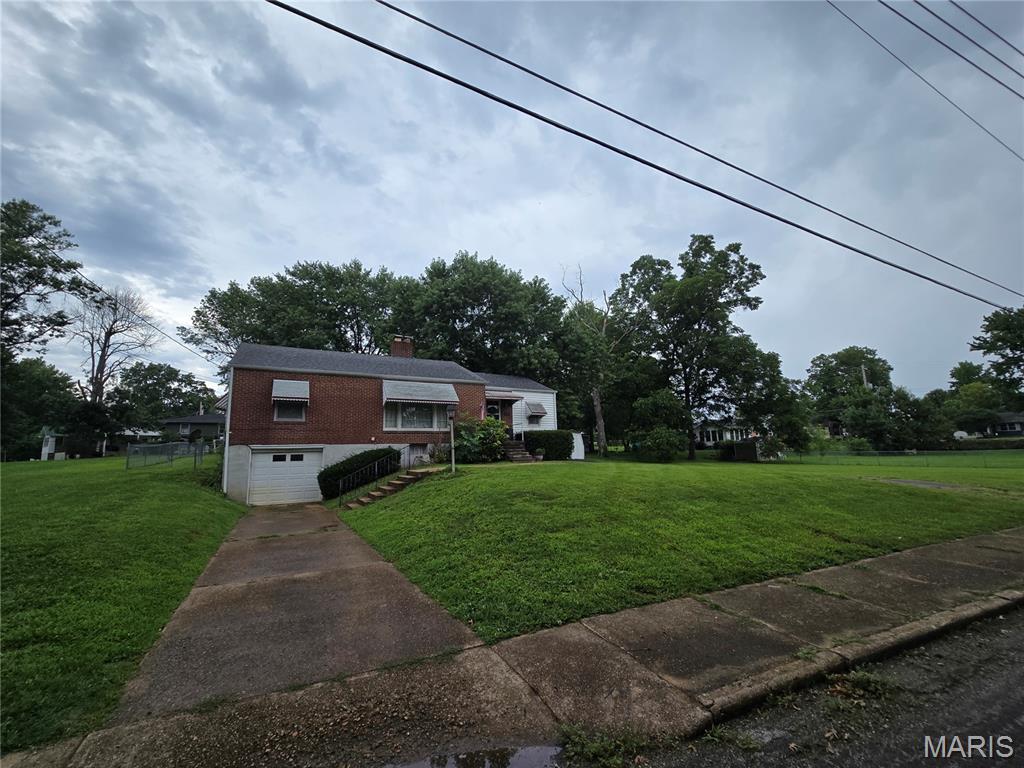 Welcome to this inviting 3 bed / 2 full bath home, situated on almost a half-acre level lot, in the heart of Union, Missouri! Step inside to find hardwood floors throughout the main living areas of the house, adding to the warmth and charm throughout. The spacious kitchen, featuring stainless steel appliances, has plenty of counter space to meet your needs. Downstairs, you'll find a partially finished walkout basement and a separate living room, offering more gathering space for entertainment. The fenced-in backyard, with its level slope, is perfect for those relaxing midwest evenings. This home has been well-kept, and offers the perfect blend of comfort, character, and space. Schedule your private showing of this home today!
