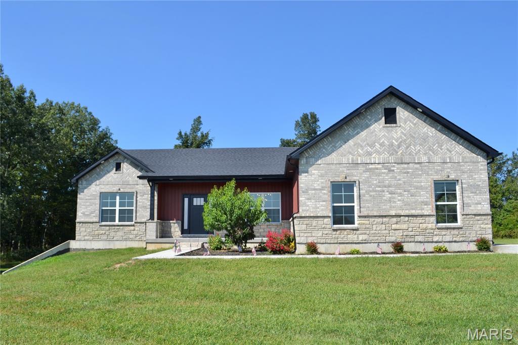Welcome to your new home in the heart of Missouri wine country, where scenic countryside and modern living come together on 3.24 beautiful acres. This brand-new construction offers the space, privacy, and thoughtful design you've been waiting for, all just minutes from Farmington.

Step inside to an inviting open-concept living area featuring vaulted ceilings, a striking fireplace, modern fixtures, and carefully selected finishes throughout. The split-bedroom floor plan provides privacy and functionality, with a spacious primary suite designed to be your personal retreat. Enjoy a luxurious soaking tub and generous walk-in closet.

The walk-out basement is partially finished and offers versatile space ready to accommodate your needs, whether you're looking for a recreation room, home office, workshop, or additional living area. Outside, the corner lot backs to the woods, creating a peaceful setting with abundant privacy and plenty of room to enjoy the outdoors.

Craftsman-inspired masonry work and quality details add character and distinction throughout the home. A convenient 2-car garage provides ample parking and storage. With acreage, wooded views, new construction, and a desirable location near Farmington, this property offers a rare opportunity to enjoy the best of country living without giving up modern convenience.

Come make this beautiful new house your home and experience the space, privacy, and serenity of Missouri countryside living.