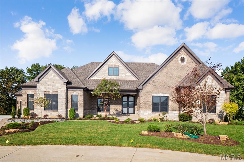 New Construction (Currently Under Construction)! Built by one of St. Louis' premier hands on builders Claymont Development, LLC - Wesley Byrne. This MARVELOUS "KELLY" Atrium Ranch is a 4 bed, 2.5 bath home of approximately 5,500 sq ft w/ 3 car side entry garage. Hand forged wrought iron entry door leads to the foyer w/ 12' ceiling.  Great room features 12’ ceiling, wall of windows & fireplace paired w/ cabinetry & bookcases. Vaulted hearth room w/ floor to ceiling Masonry fireplace open to the gourmet kitchen w/ HUGE island, all SS appliances, & gorgeous custom cabinetry. 2nd and 3rd spacious bedrooms connected by a Jack and Jill Bath. All bedrooms include a walk in closet. Coffered ceiling in Owner’s Suite. Unique brick & stone covered patio. Walkout Lower Level includes a spacious rec room, custom brick & stone wet bar, 4th bed & bath. Amenities include: onsite pickle-ball court, walking trail, common ground, & gazebo. Pictures of a previously built home. Tour is the Display Home.