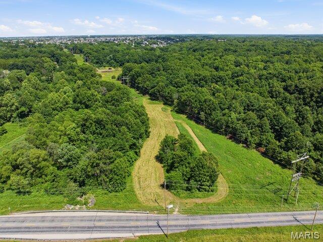 Discover the perfect blend of privacy, potential, and peaceful surroundings with this beautiful 4+ acre parcel located in unincorporated Wentzville. Featuring mostly flat land, this acreage offers the ideal setting to create your own private oasis and has a charming creek running through the property.  Whether you’re dreaming of building a custom home or you’re a builder looking for an incredible opportunity to expand, this property is full of possibilities. This growing community is conveniently close to shopping, dining, schools, and major highways. A rare opportunity to own a slice of serenity in one of the area’s most desirable locations!