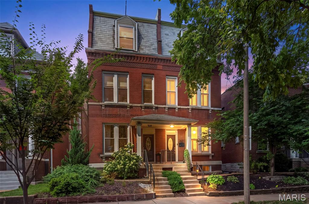 Beautiful historic architecture meets stylish modern updates in the heart of Tower Grove East. The covered front porch welcomes you into this fully renovated home, where soaring ceilings, original character and a thoughtfully designed open floor plan create an inviting sense of space. The spacious living room features beautiful wood floors and flows into a dining room highlighted by a dramatic tray ceiling and recessed lighting. The large, open kitchen is designed to impress with 42" cabinetry, granite countertops, stainless steel appliances and two pantries. A generously sized powder room adds convenience on the main level.
Upstairs, the expansive owner’s suite offers a walk-in closet and private en suite bath, while a second bedroom, full bath and convenient laundry complete the second floor. The third level continues with beautiful wood floors and provides two additional large bedrooms and another full bath. Out back, enjoy a deck overlooking the level yard, along with an oversized three-sided garage. A brand-new TPO roof and gutters, newer water heater, updated windows with plantation shutters, zoned HVAC, and full basement add comfort and peace of mind. Ideally located near parks, dining and entertainment, this beautifully updated home delivers historic charm and modern style in an exceptional location.  With an already passed occupancy inspection, you can move in and enjoy!