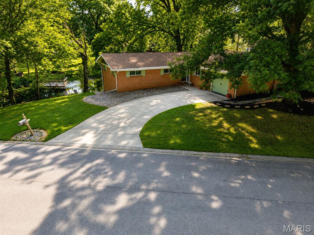 Welcome to 3832 Tanbark Dr! Nestled in the desirable Country Acres community and offering a peaceful setting surrounded by nature, this inviting all-brick 3 bedrooms 3 full baths and a walkout basement home combine everyday comfort with the appeal of a scenic outdoor lifestyle, featuring beautiful private lake view perfect for fishing, relaxing and more. Located within the sought-after Wolf Branch School District, this property offers an excellent opportunity for buyers looking for both convenience and a tranquil neighborhood setting.

Imagine starting your morning with coffee surrounded by nature, spending afternoons fishing at the lake, or enjoying quiet evenings in your own outdoor retreat. With its desirable location, natural surroundings, and recreational appeal, this home is simply a timeless indoor-outdoor charm with lifestyle that is increasingly hard to find. Whether you are looking for a place to settle in or a property with a unique advantage, 3832 Tanbark Dr is thoughtfully designed with an easily warm layout flow from room to room and functional space for everyday living and entertaining deserves your closer look.

Seize the opportunity to experience this exceptional property for yourself -schedule your private tour today!