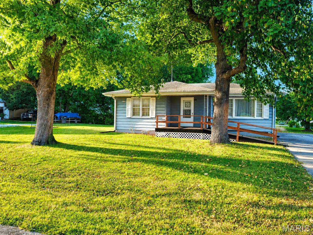 Welcome to 208 Mary Street in Hardin! Situated on approximately 2.5 flat lots and located outside the floodplain, this solid 2–3 bedroom home offers plenty of potential for its next owner. Inside, you'll find original hardwood floors that add warmth and character throughout the home. The third bedroom has been converted to a convenient main-level laundry room but could easily be returned to bedroom use, with laundry hookups relocated back to the full unfinished basement.  Bathroom has been recently updated. The basement provides plenty of additional storage and possibilities for future use. A handicap-accessible ramp provides easy access to the front entrance. While the home is ready for some cosmetic updating, it offers a great opportunity to make it your own. With a spacious, level yard and a convenient Hardin location, this property has plenty to offer!