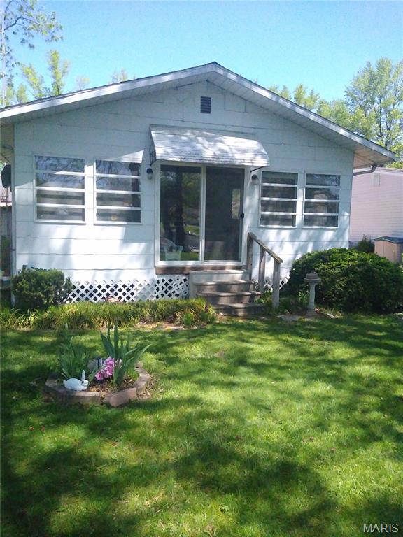 Cute furnished cabin facing the lakefront. Owner is leaving furniture, artwork, decorations and appliances. Just pack your bags and move right in. There is a window and a wall air conditioners. For additional parking there are parking spaces on both sides of the cabin. A small storage shed will hold your yard tools and a lawn mower. Selling in "AS IS" condition and is not making repairs.
