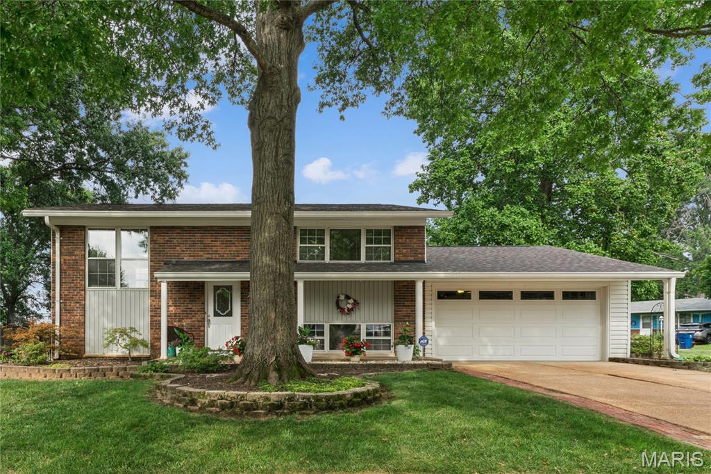 Situated on one of the largest lots in the community, this lovely home has been renovated from top to bottom—inside and out—with impeccable style, quality finishes, and updated systems. Its alluring appeal begins with an open, flexible floor plan offering two spacious bedrooms, custom closet systems, and beautifully renovated baths on each level.

The kitchen shines with granite-topped custom 42' Maple cabinetry and seamless access to the deck, perfect for grilling and outdoor dining. The lower level opens to a peaceful, shady brick patio and a fully fenced backyard—an ideal retreat for quiet mornings or relaxed evenings.

Extensive updates include irrigation system, Maple adult-height vanities, solid maple hardwood floors - main level, new Luxury Vinyl Plank with baseboards and trim, newer black fencing with oversized gates, newer insulated garage door and opener. flooring - lower level, new carpet - bedrooms, 6-year-old roof with 14-year transferable warranty, newer deck, newer doors and knobs,  fresh paint, electrical, wrought iron stair balusters, 

Located within walking distance of highly desirable Rockwood schools and just minutes from highway access, shopping, restaurants, and everyday conveniences, this home blends comfort, charm, and exceptional livability.