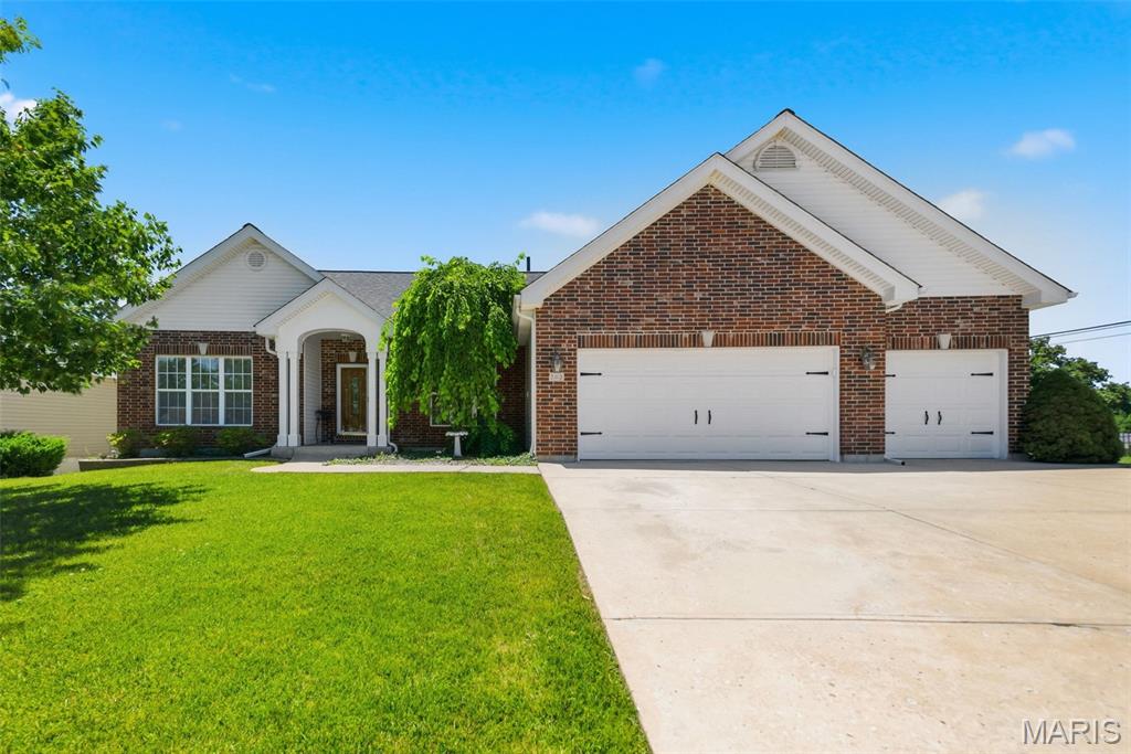 This custom-designed split-bedroom floor plan offers exceptional space, comfort, and functionality! Upon entering, you'll be welcomed by soaring vaulted ceilings, a cozy gas fireplace in the living room, and a separate formal dining room—perfect for entertaining.  Upgrades throughout the home include 9 ft ceilings, crown molding, wainscoting, & custom millwork! 

The kitchen features abundant cabinetry, beautiful countertops, and easy access to the maintenance-free deck just off the kitchen, creating the ideal space for indoor-outdoor living. The spacious primary suite includes two closets and a private en suite bath complete with plantation shutters, shower, & separate soaking tub.

On the opposite side of the home you'll find two generously sized bedrooms & hall bath with 3-foot-wide doorways designed for convenience and accessibility. The full bathroom is accessible from the hallway, as well as being connected to the en suite half bath of the 2nd bedroom by a pocket door. 

The finished walk-out lower level expands your living space with a large family room featuring a wet bar, full bathroom, and two oversized bedrooms filled with natural light. A dedicated workshop area and extensive built-in storage provide plenty of room for hobbies and organization.

Step outside through the sliding doors to enjoy the private backyard—an ideal setting for relaxing and unwinding. Located within the highly sought-after North Point School boundaries and just minutes from shopping, dining, and everyday conveniences. Recent updates include a new roof, gutters, siding and rear/west side windows in 2024. Irrigation system in place although not in use; bf tested.