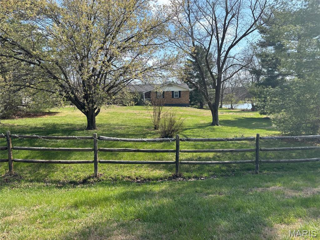 HUGE PRICE DROP!!! MOTIVATED SELLER!!!

Private Ranch Retreat on Nearly 1 Acre with Scenic Water View 

Just minutes from Pacific, this beautifully maintained spacious 3-bedroom, 2-bath ranch home on nearly one acre offers a rare combination of space, privacy, and convenience. Nestled on a generous corner lot surrounded by mature trees and thoughtful landscaping, this property feels like a peaceful retreat while still being close to shopping, dining, and the highly regarded Meramec Valley R-III School District.

Step inside to discover a light-filled open floor plan designed for both everyday comfort and effortless entertaining. A formal dining space flows seamlessly into the welcoming family room, where a cozy wood-burning fireplace creates the perfect gathering place for relaxing evenings or hosting friends and family.

The bright and functional kitchen features warm wood cabinetry, generous counter space, pantry storage, and a breakfast bar, along with stainless steel appliances including an electric range,  dishwasher (installation scheduled) and refrigerator.

One of the home’s most inviting features is the charming three-season sunroom, where you can enjoy morning coffee or unwind in the evenings while taking in peaceful water views and nature-filled surroundings. Just outside, the extended patio creates an ideal setting for outdoor dining, entertaining, or simply enjoying the changing seasons in your own backyard oasis.

The primary suite offers a comfortable private retreat with an adjoining bath and shower, while two additional bedrooms and a full hall bath provide flexibility for family, guests, or a home office.

The partially finished walk-out basement expands the living space with room for a recreation area, media room, or game lounge, along with a dedicated laundry area and abundant storage.

Additional highlights include:

• Full brick exterior for timeless durability

.  This home is solid & well built...they don't make them like this anymore!

• Oversized 24 x 22 two-car side-entry garage

• Extended aggregate driveway and walkway

• Storage shed included

.  New flooring on main floor 2026  

• Nearly one acre corner lot offering privacy and space

Homes offering this much land, privacy, and scenic surroundings rarely become available this close to Pacific, making this a unique opportunity for buyers seeking a peaceful lifestyle with modern convenience.

You won't want to miss this GEM! Schedule your showing appointment today!

Seller prefers to sell "As Is".