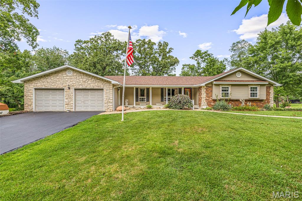 Welcome home! This spacious ranch style home is nestled on approximately 1.3 beautifully landscaped acres just outside the city limits. Surrounded by mature trees, this property offers the perfect blend of privacy with the convenience of town minutes away. The main level features 3 bedrooms, 2 full baths, a welcoming living room centered around a cozy fireplace, and a formal dining room just off the kitchen—ideal for everyday living or entertaining. Step outside to the large back deck, where you can enjoy the peaceful views while sipping your coffee. The walk-out lower level expands the home's possibilities with a second full kitchen, a spacious family room featuring a second fireplace, a full bath, and direct access to the backyard. Whether you're looking for guest quarters, multi-generational living, or additional entertaining space, this flexible layout has you covered.
Car enthusiasts, hobbyists, or those needing extra storage will appreciate the attached 2-car front-entry garage along with an additional 2-car drive-under garage and carport accessible from the rear of the home.
Outside, you'll love relaxing beneath the gazebo while taking in the beauty of the mature shade trees and a beautiful yard. Enjoy the peaceful setting of country living with the convenience of being just minutes from town, call today for your personal tour- won't last long!