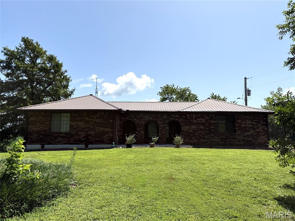 Timeless Brick Charm on 1 Acre with Flexible Layout & Finished Walk-Out Basement!
Welcome to this spacious and beautifully crafted all-brick home, perfectly situated on a serene 1-acre lot. Offering incredible space, versatility, and classic appeal, this property features 3 full bathrooms and a flexible floor plan designed to fit your lifestyle—currently configured with 4 bedrooms, with the potential for up to 6!
Step inside to a spacious living area centered around a cozy gas log fireplace, perfect for cool evenings. The living room opens up to a nice dining room and kitchen. 
Flexible Bedroom Count: Four dedicated bedrooms offer plenty of space for family and guests, while two additional flex rooms (ideal for a home office, gym, or hobby room) easily serve as a 5th and 6th bedroom.
The finished lower level dramatically expands your living space, featuring direct access to the backyard, excellent natural light, additional sleeping quarters, and room for a rec room or theater.
 Enjoy peaceful country views and outdoor entertaining on your private 1-acre property, offering endless possibilities for gardening, play, or future additions.
Solid brick construction, room to grow, and peace of mind on a full acre—this is the home you’ve been waiting for!