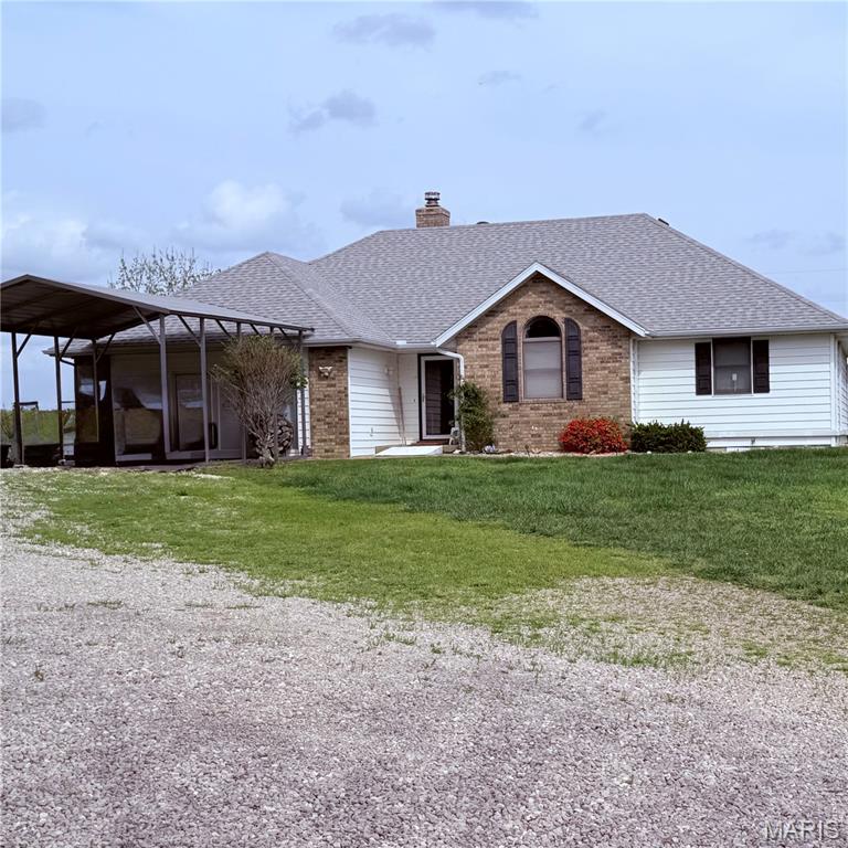 Custom home on 10 acres featuring 2 ponds (1 spring-fed and stocked), plus 6+ acres of fenced pasture. Discover the perfect blend of comfort, space, and location with this beautiful home situated just outside city limits—offering privacy while remaining conveniently close to Mercy Hospital, interstate access, and shopping. This spacious property features 3 bedrooms and 2 bathrooms, along with a cozy living room and an additional living area converted from the garage—perfect for a second lounge, office, or entertainment space. Additional living space includes a family/sun room with tile flooring suitable for multiple uses. Primary bedroom includes walk-in closet and private bath. Upstairs, you’ll find an extra bonus room that adds even more flexibility. The kitchen is a standout, offering abundant cabinet space, a pantry, and updated countertops—ideal for anyone who loves to cook and entertain. Step outside onto the back deck and take in the peaceful view.  The land is rich with a variety of trees, including walnut, multiple types of fruit trees, wild plum, as well as elderberry, gooseberry, and blackberry bushes. For those who need workspace or storage, the property includes an impressive 4- bay garage/shop with concrete floors and electricity, plus a large carport equipped with electric and water hookups—perfect for an RV. Home includes outdoor kitchen area, and a storm shelter. This property truly has it all—space, upgrades, and a serene setting. Homes like this don’t stay on the market long!