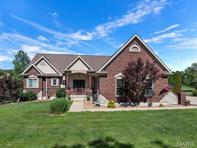 Enjoy stunning views from this spacious 4-bedroom on 3 private acres.  This 3700+- square foot executive home offers Three Ensuites. The primary suite features a walk-in closet and separate shower. An upper-level indoor balcony overlooks the property and includes optional doors for added privacy. The custom kitchen offers tons of custom cabinets, a cooktop, breakfast bar, pot filler, and plenty of workspace for cooking and entertaining.  Custom paint, decorative lighting, and window treatments add style and character, while beautiful hardwood flooring on the upper level complements the carpeted bedrooms. The finished lower-level features gas fireplace, dedicated media room, entertaining space with wet bar, large storage area, and additional laundry hookups.  Roof is only 3 years old.  Brand New HVAC. Outbuilding is connect to solar with rain water catchment systems for garden.