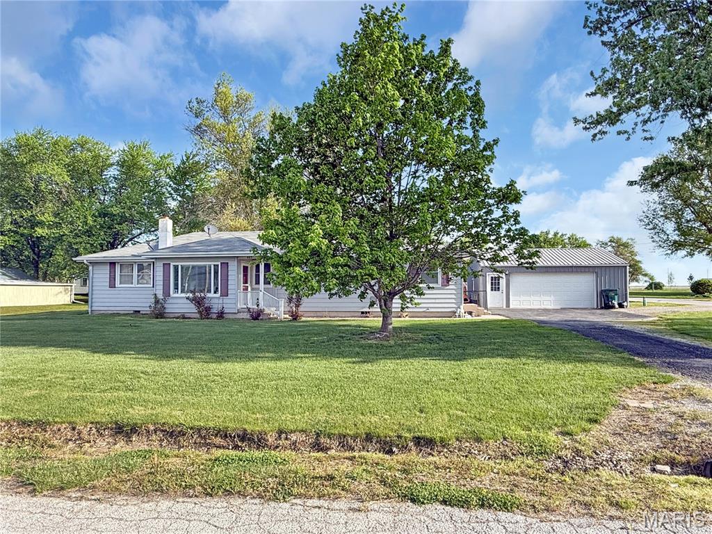 Welcome to this well-maintained ranch-style home offering 3 bedrooms, 2 bathrooms, and 1,512 square feet of comfortable, all one-level living. Situated on the edge of town, this property provides the perfect balance of convenience and a peaceful setting. Inside, you’ll find a spacious layout designed for everyday living, highlighted by a large primary bedroom and an updated primary bathroom featuring a walk-in shower. The home has been thoughtfully cared for, making it move-in ready for its next owners. Outside, enjoy the added bonus of a nice 2-car detached garage—perfect for vehicles, storage, or a workshop space. Call today!