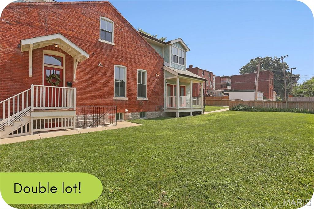Picture your weekends starting with coffee on the porch, an afternoon spent tending your garden, and an evening walking to dinner or live music—all without moving your car. This beautifully renovated 1885 bungalow puts you in the heart of one of St. Louis' most walkable neighborhoods. Grab dinner with friends at Yemanja Brasil, Frazer's, or Peacemaker, catch a show at Venice Cafe, or wander over to Benton Park for movie nights, festivals, and sunny afternoons. The showstopper? The incredible double lot. It's the kind of outdoor space that's almost impossible to find in the city. Create your dream garden with raised beds, add a fire pit, let your dog run free, plant a pollinator paradise, or finally build the backyard you've been saving on Pinterest. There's even room for a pool if that's on your wish list. You get all the historic charm of an 1885 home on the exterior but on the inside, it's been thoughtfully renovated with updated systems—including zoned HVAC—so you can move right in and start enjoying your new space from day one. The main floor offers a bright living room, dining room, updated kitchen, and convenient half bath. A covered side porch overlooks the expansive fenced yard, creating the perfect spot for morning coffee or winding down after work. With no house directly to the south, natural light pours inside all day, making this a dream home for both you & your houseplants. Upstairs, you'll find two comfortable bedrooms—including one with double closets—and a full bath featuring double vanities plus skylights that flood the space with even more natural light. The squeaky clean basement adds laundry & lots of storage + the rear parking pad adds everyday convenience. If you've been searching for a home with character, outdoor space, and a neighborhood that feels like a community, this is one you won't want to miss. Skip the Zillow shuffle and reach out to me--the listing agent--to schedule your private tour.