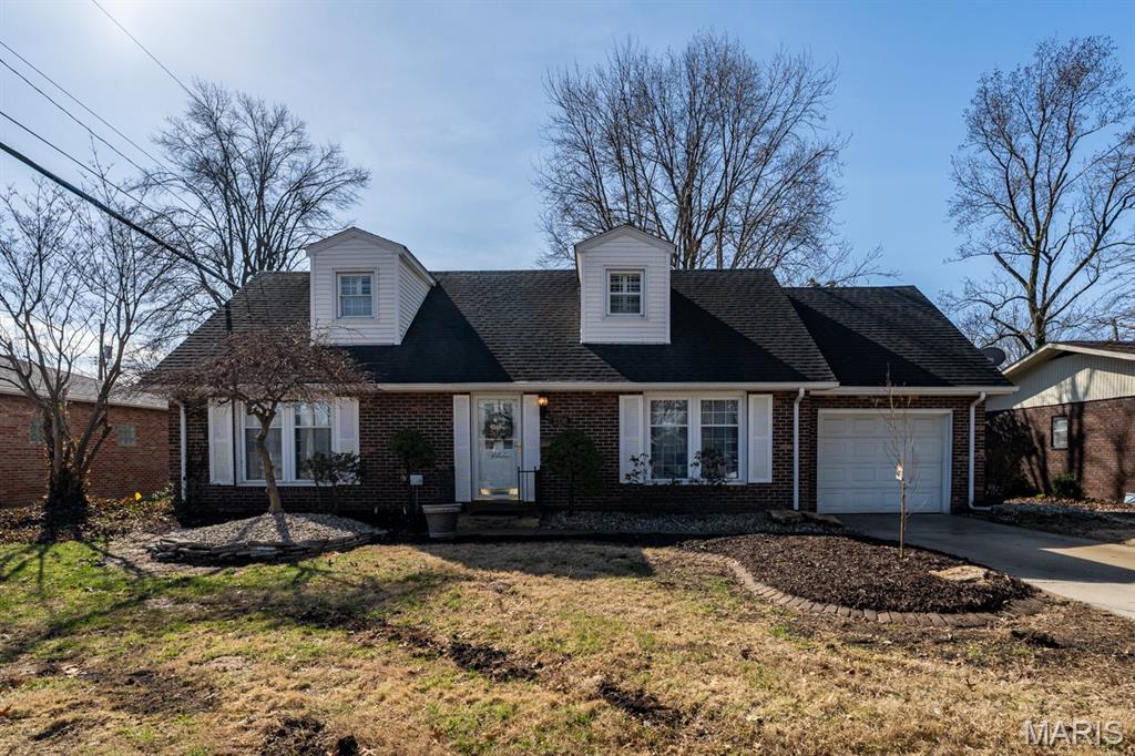 Gorgeous updated Cape Cod House, with brick exterior Front with large fenced lot with a one car attached garage. Cape Cod homes has been celebrated for their timeless, "all-American" charm, and its hear to offer you loads of space to enjoy family and friends. Front of home is nicely landscaped with charming front entry, that shows the elegance and nice vinyl windows. Once inside, a spacious foyer greets you, and invites you to stroll on through with its open windows that flow from ceiling to floor you are greeted on the left with its inviting cozy formal living room.  Working your way right is where you will be able to entertain with family and friends in this beautiful formal dining room. The beautiful hardwood staircase to the upper level stands as beacon to the home. Hardwoods throughout main and upper floor. Gourmet kitchen, offers some brand new appliances, corian countertops, beautiful wood cabinets. Kitchen has tons of sunshine with / lg. sliding glass doors inviting you outside to a beautiful new concrete patio, where outside entraining abounds. Primary bedroom offers comfort in mind,  featuring a lovely hardwood floors and lovely plantation shutters, room is spacious and offers a dormer window area great for a reading nook. Second and third bedrooms are spacious offering hardwood floors, and are equally inviting, w/ ample closet space & windows w/ of sunlight.  4th bedroom is on main level and offers space for office or bedroom. Family room in lower level is 23x21, is open for entertaining with friends .  The backyard /private oasis, /70.1X 115 lot open and fenced with a nice outdoor Storage Barn. Agent Owned