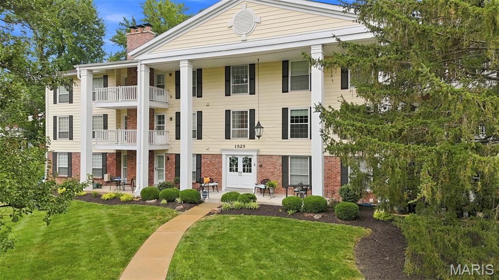 Enjoy comfort and convenience in this beautifully updated 2-bedroom 2-bath condo.  Wood-style flooring (2026) flows thru most of the home.  The living room boasts cozy gas fireplace with marble surround.  Step out on your private deck and unwind while enjoying tranquil view of peaceful, wooded area.  The dining room is perfect for those special occasions. An updated in in kitchen features white cabinets, hard surface counters and stainless-steel appliances.  The den flowing from the living room is a perfect sport for office or private retreat . Main bedroom includes an ensuite updated bath with double sinks and a large walk in closet.  2nd bedroom has a walk in closet.  Hall bath has tub/shower and double vanities.  With convenient in-home laundry, garage and modern updates, this space combines comfort, style and practicality.  Walk to park, shopping and restaurants.