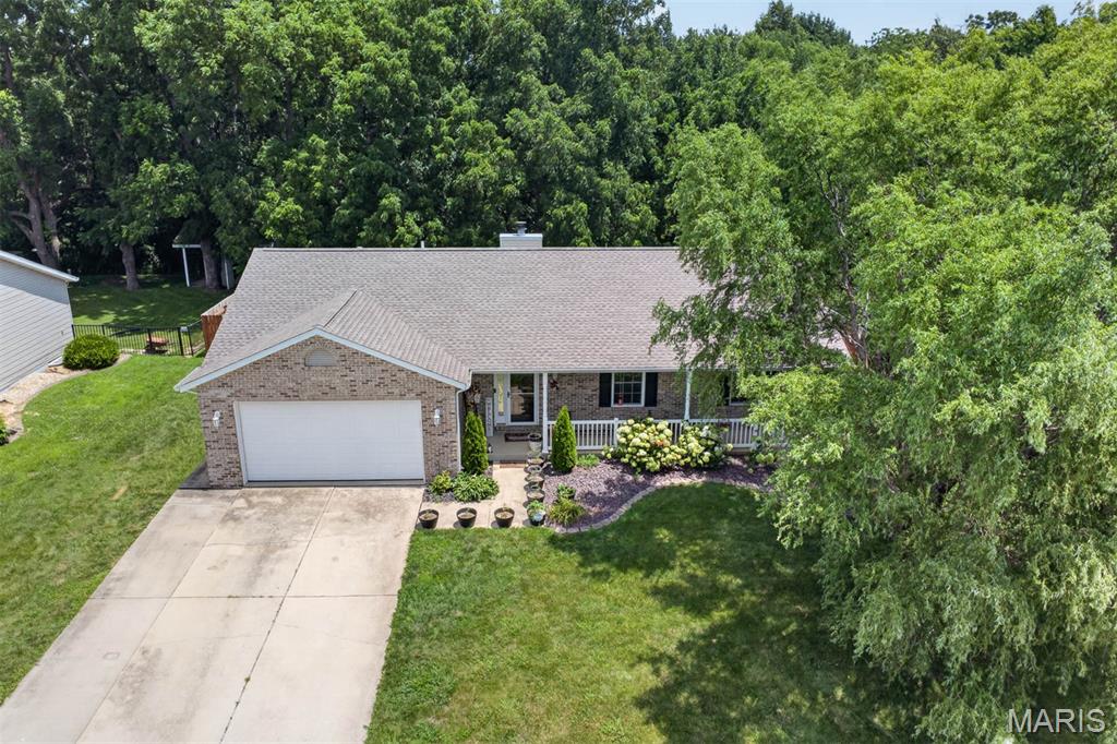 Welcome home! This beautifully maintained 4-bedroom, 2.5-bath home sits on a quiet dead-end street in the highly sought-after Highland School District. The open-concept main level features a bright kitchen, spacious living and dining areas, wood-burning brick fireplace, laundry, and a generous primary suite with walk-in closet and private bath. The finished basement adds a fourth bedroom, additional non-conforming bedroom/office, large family room, flex space, and half bath—offering plenty of room to live, work, and entertain. Enjoy a privacy-fenced backyard backing to woods with no rear neighbors! Additional highlights include a 2-car attached garage, brick-front exterior, 200-amp service, brand-new roof, new sump pump with battery backup, abundant storage, and video doorbell. Move-in ready, private, spacious, and packed with updates—this one is a must-see!