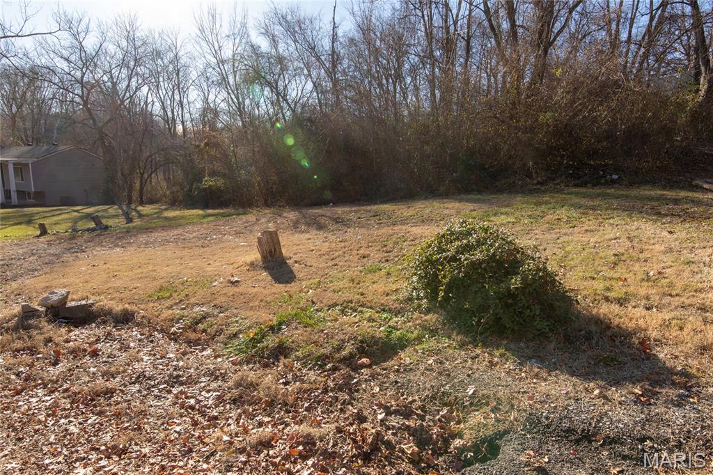 Are you looking for a little piece of paradise outside city limits where you can build without subdivision limitations. You just found it. These 2 parcels total .5 acres and are located in an established neighborhood outside of city limits ready for you to build your dream home. Seller will sell outright or build to suit.