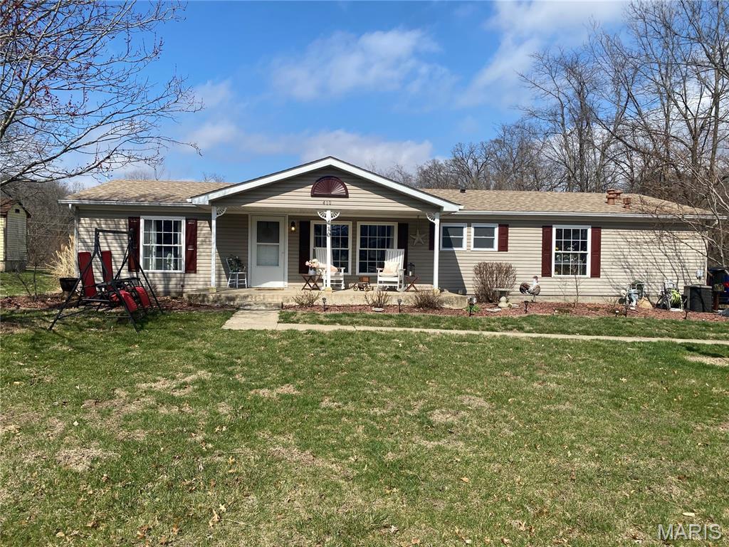 Prepare to be impressed by this beautifully updated 3-bed, 2-bath ranch featuring a sought-after split-bedroom layout and updated finishes throughout. The heart of the home is an expansive living room anchored by a cozy gas fireplace, flowing seamlessly into an open-concept kitchen and dining combo—perfect for entertaining. The private primary retreat is a true standout, boasting a custom wooden accent wall, a large walk-in closet, and a full ensuite bathroom. On the opposite side of the home, you’ll find spacious secondary bedrooms, including one with a stylish shiplap accent wall. Practicality meets peace of mind with a brand-new roof (2025) and a dedicated laundry room. Outdoor living is a breeze with a charming covered front porch, a private backyard with a patio, and a detached garage for great storagee. This move-in-ready gem combines modern character with essential upgrades—don’t miss out!